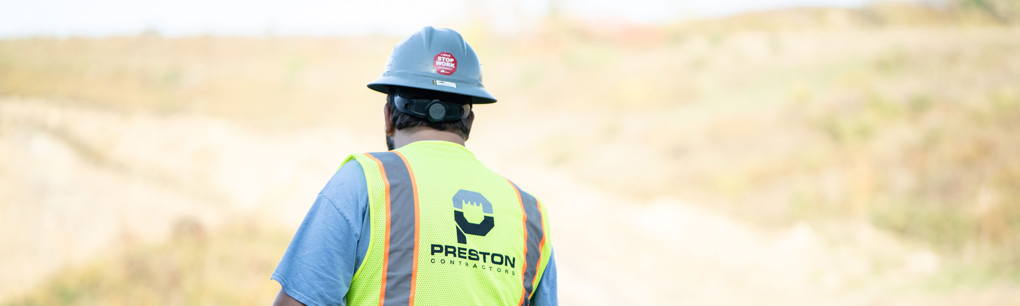 Preston Contractors Employee Wearing Hard Hat & Neon Vest
